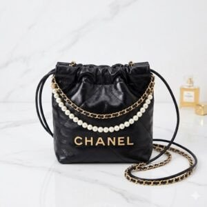 Chanel 22 Mini Handbag Shiny Black Leather with Pearl Accents & Vintage Gold Hardware 19x20x6cm