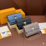 Louis Vuitton Monogram Empreinte Leather Chain Wallets The Ultimate Fusion of Heritage and Modern Elegance 28