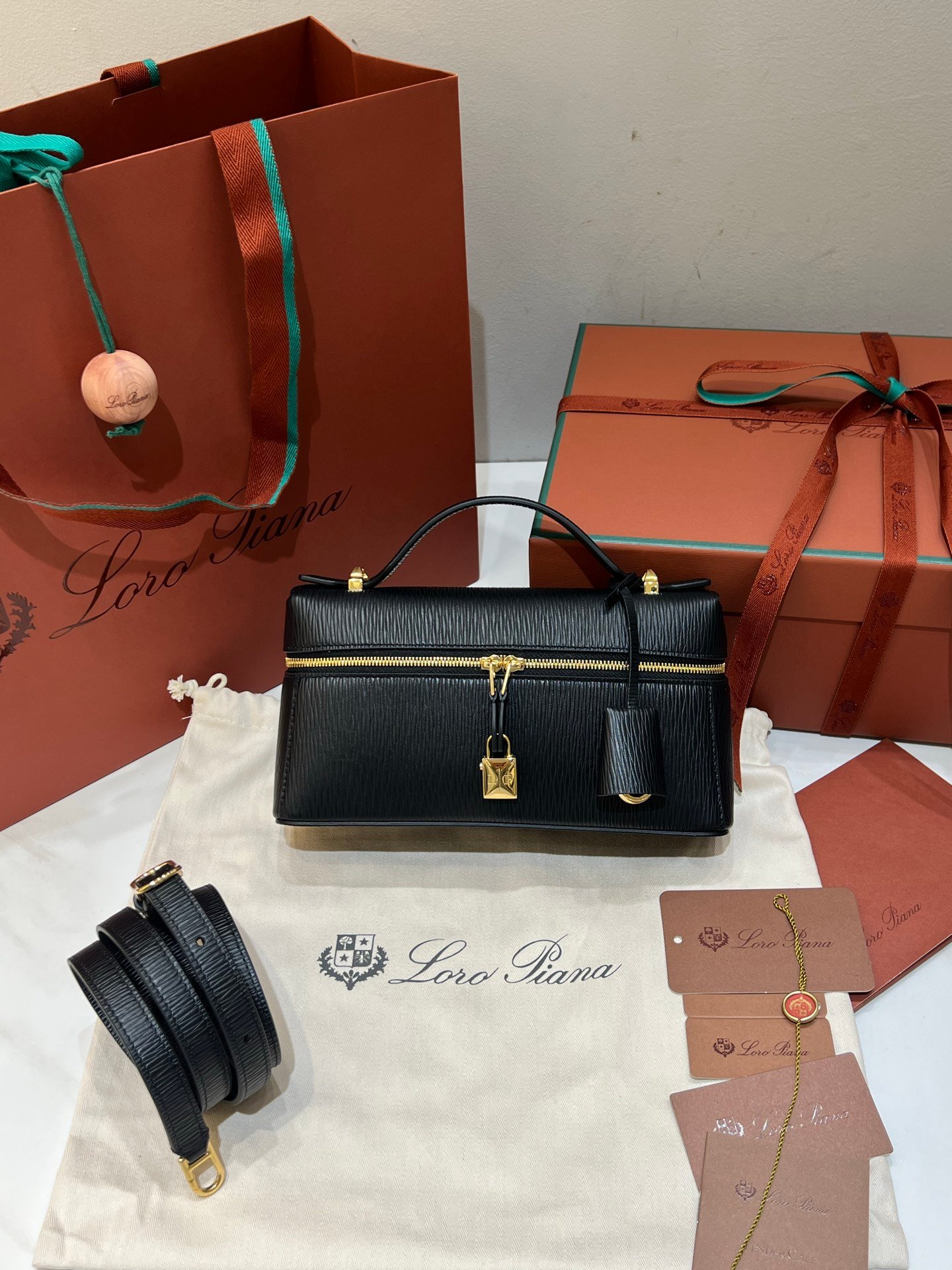 Loro Piana L23 Extra Handbag 23cm Black Textured Leather Minimalist Shoulder Bag with Gold Hardware and Gift Box Loro Piana L23 Extra Handbag 23cm Black Textured Leather Minimalist Shoulder Bag with Gold Hardware and Gift Box
