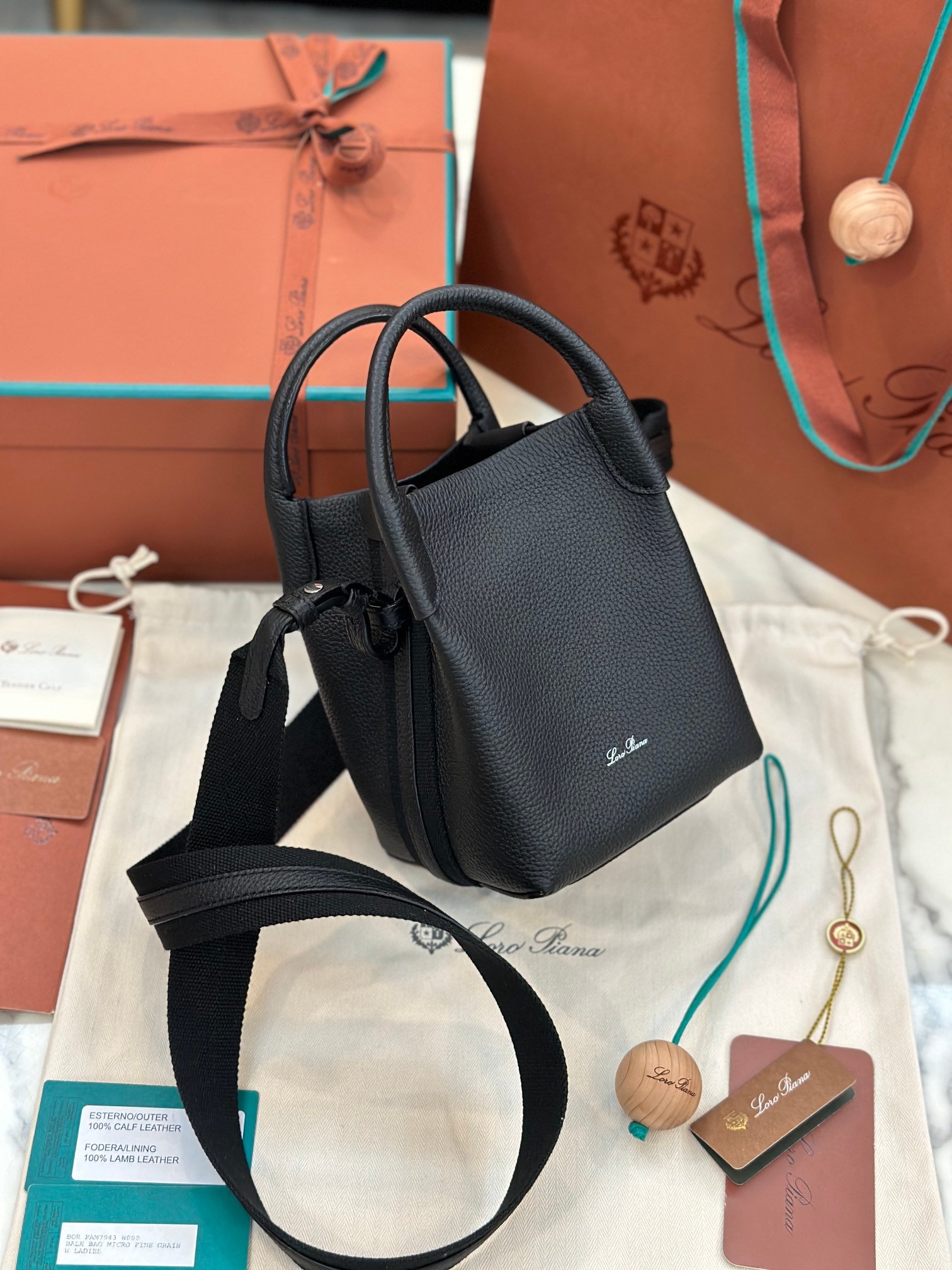 Loro Piana Bale Mini Bucket Bag Grained Calfskin Sophisticated Shoulder and Crossbody Handbag Craftsmanship and Versatile Luxury Loro Piana Bale Mini Bucket Bag Grained Calfskin Sophisticated Shoulder and Crossbody Handbag Craftsmanship and Versatile Luxury
