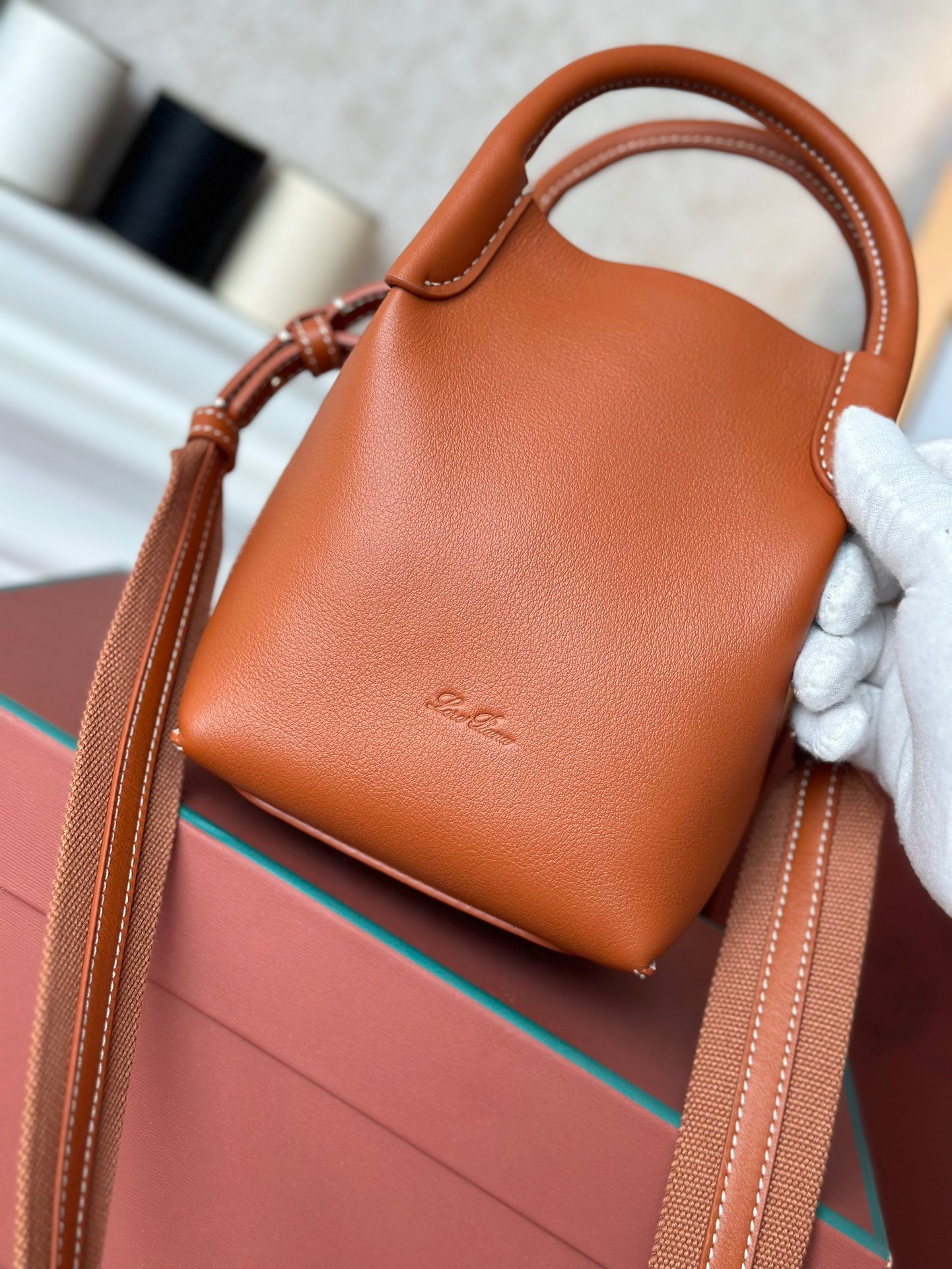 Loro Piana Mini Bale Bag 13x16x13cm Grained Calfskin Luxury Designer Mini Bucket Bag with Adjustable Crossbody Strap Loro Piana Mini Bale Bag 13x16x13cm Grained Calfskin Luxury Designer Mini Bucket Bag with Adjustable Crossbody Strap