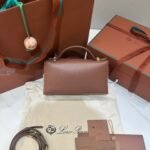 Loro Piana Extra Bag L23 Caramel Leather & Linen Canvas Crossbody Handbag 23cm for Women Top-Handle Bag with Signature Charms Loro Piana Extra Bag L23 Caramel Leather & Linen Canvas Crossbody Handbag 23cm for Women Top-Handle Bag with Signature Charms