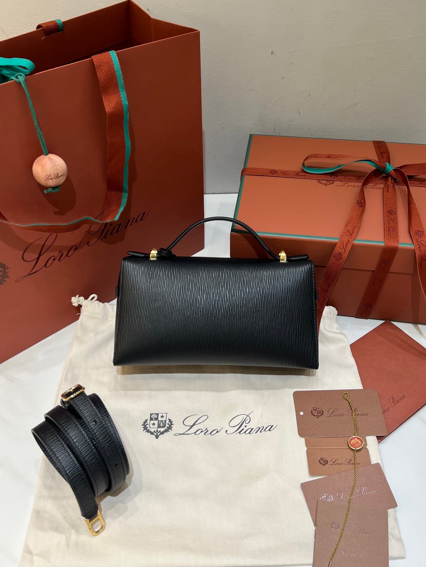 Loro Piana L23 Extra Handbag 23cm Black Textured Leather Minimalist Shoulder Bag with Gold Hardware and Gift Box Loro Piana L23 Extra Handbag 23cm Black Textured Leather Minimalist Shoulder Bag with Gold Hardware and Gift Box