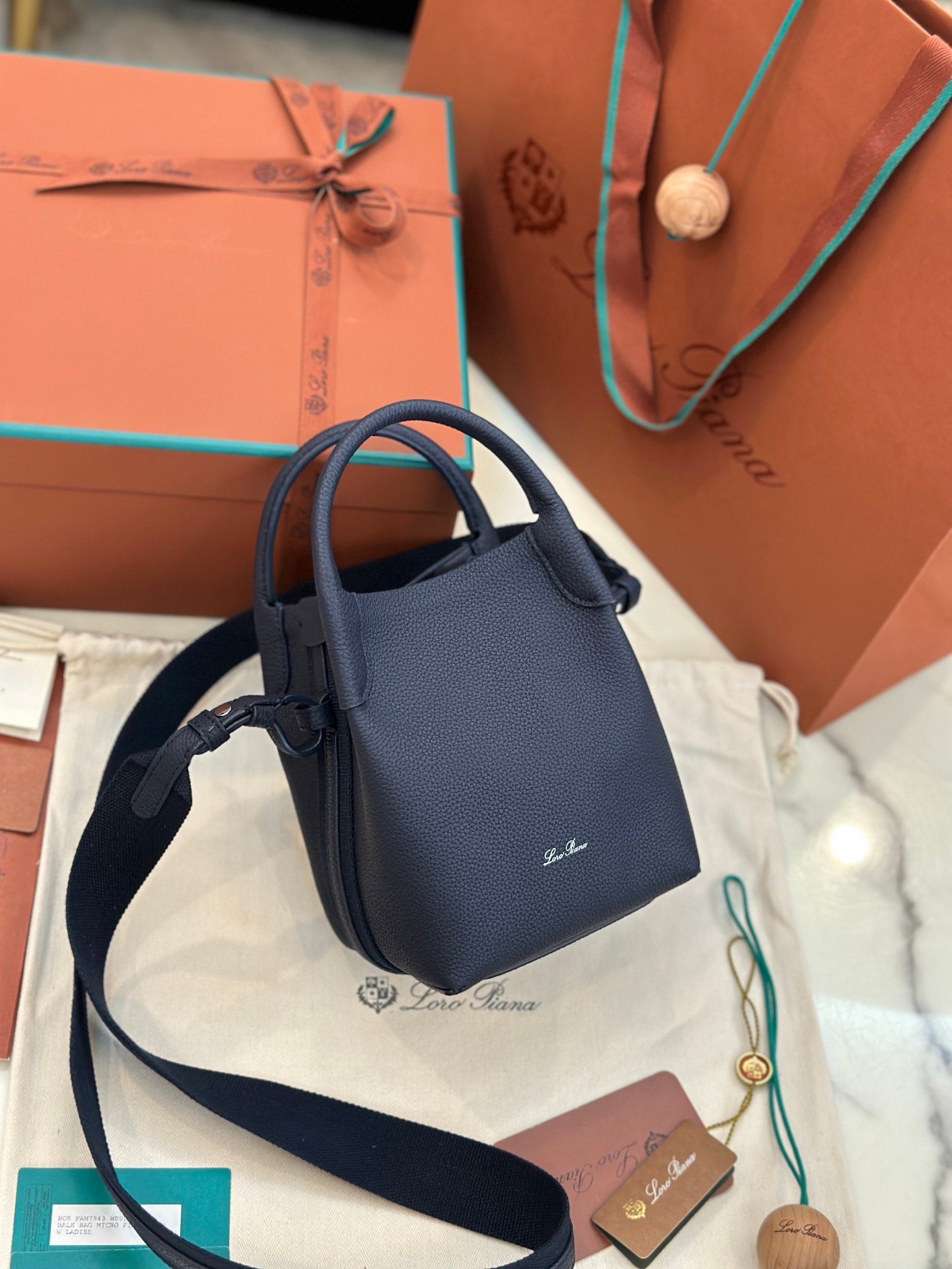Loro Piana Bale Mini Bucket Bag Grained Calfskin Sophisticated Shoulder and Crossbody Handbag Craftsmanship and Versatile Luxury Loro Piana Bale Mini Bucket Bag Grained Calfskin Sophisticated Shoulder and Crossbody Handbag Craftsmanship and Versatile Luxury