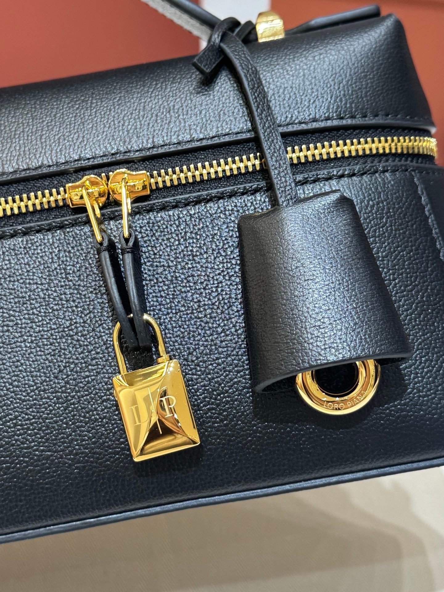 Loro Piana Extra Bag L23 Calfskin Leather Top Handle Bag 23cm Crossbody Handbag with Signature Padlock Charms and Adjustable Strap Loro Piana Extra Bag L23 Calfskin Leather Top Handle Bag 23cm Crossbody Handbag with Signature Padlock Charms and Adjustable Strap