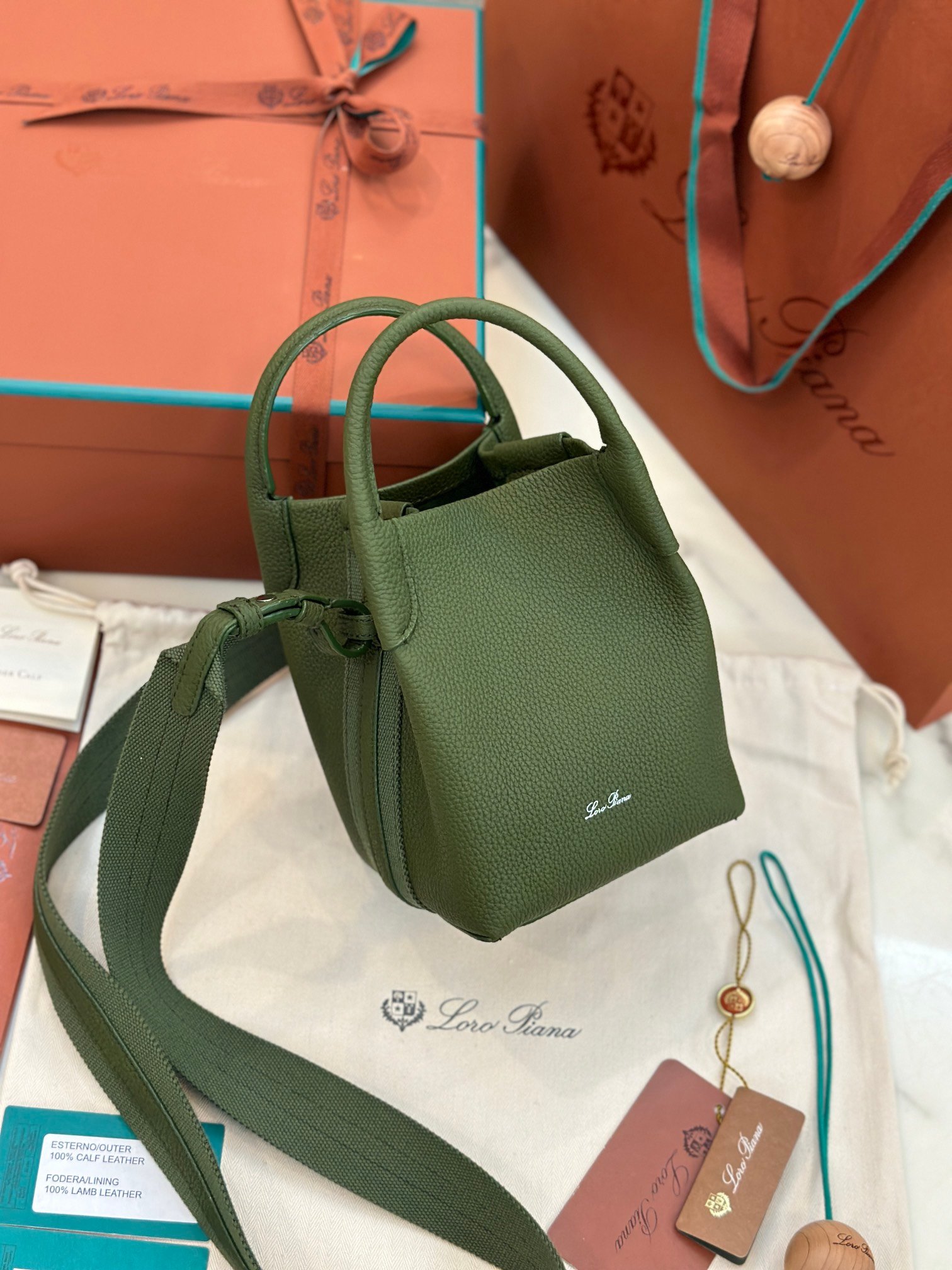 Loro Piana Bale Mini Bucket Bag Grained Calfskin Sophisticated Shoulder and Crossbody Handbag Craftsmanship and Versatile Luxury Loro Piana Bale Mini Bucket Bag Grained Calfskin Sophisticated Shoulder and Crossbody Handbag Craftsmanship and Versatile Luxury