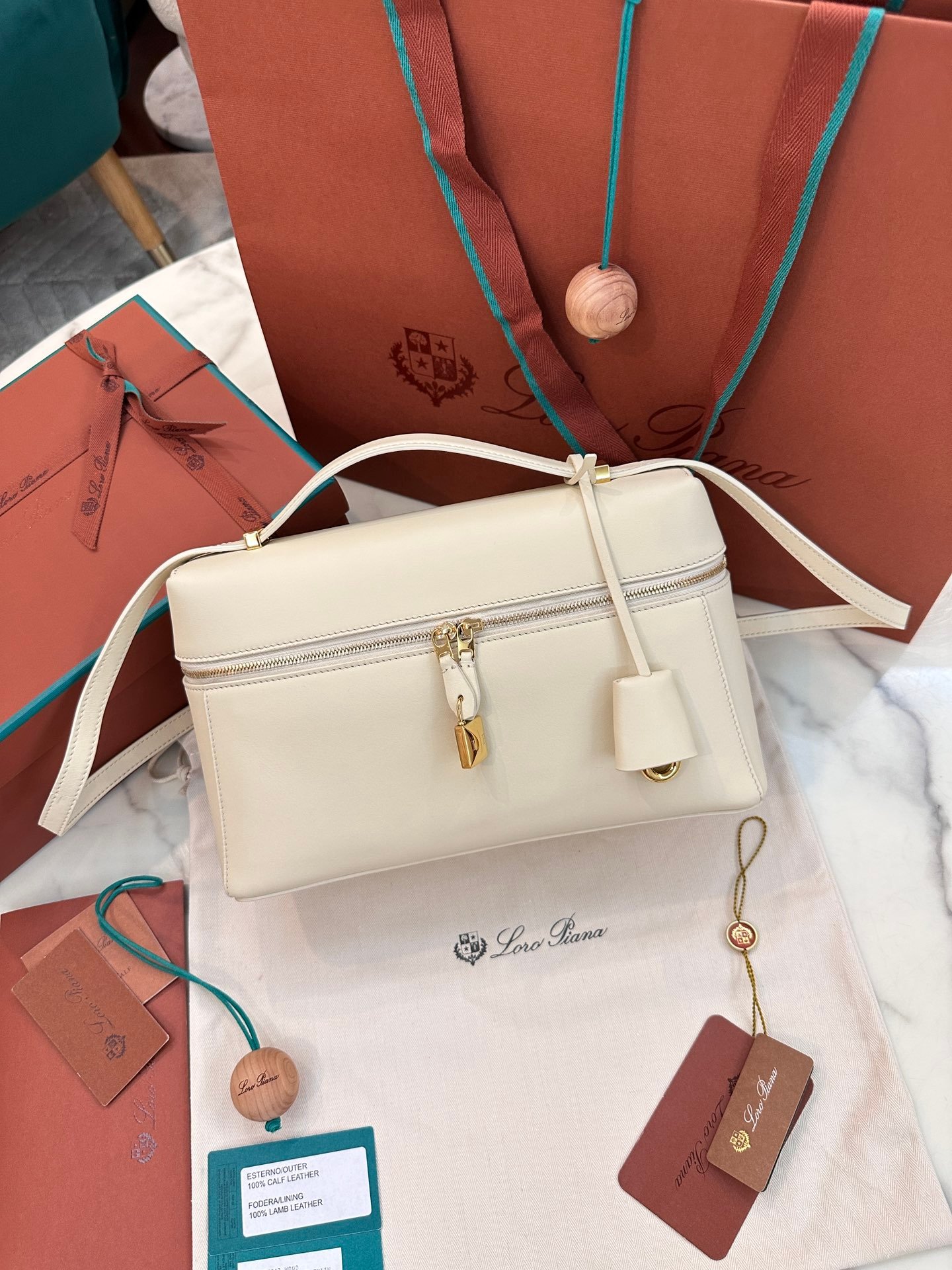 Loro Piana L27 Extra Bag 27 Minimalist Quiet Luxury Leather Tote Bag Structured Calfskin Crossbody Bag with Signature Padlock Loro Piana L27 Extra Bag 27 Minimalist Quiet Luxury Leather Tote Bag Structured Calfskin Crossbody Bag with Signature Padlock