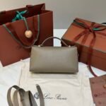 Loro Piana Extra Bag L23 Calfskin Leather Top Handle Bag 23cm Crossbody Handbag with Signature Padlock Charms and Adjustable Strap Loro Piana Extra Bag L23 Calfskin Leather Top Handle Bag 23cm Crossbody Handbag with Signature Padlock Charms and Adjustable Strap