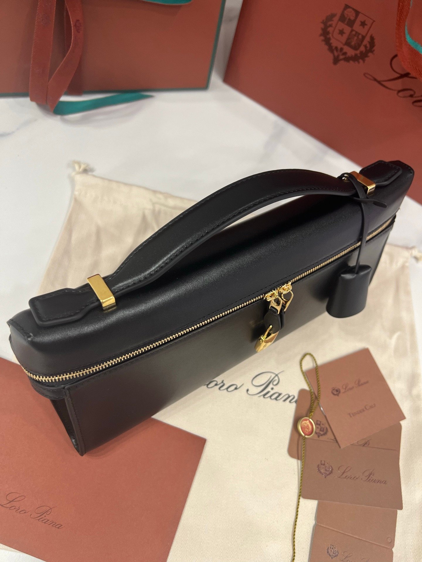 Loro Piana Extra L29 Clutch Bag 29cm Saddle Leather Elegant Handmade Designer Leather Handheld Purse with Signature Gold Padlock
