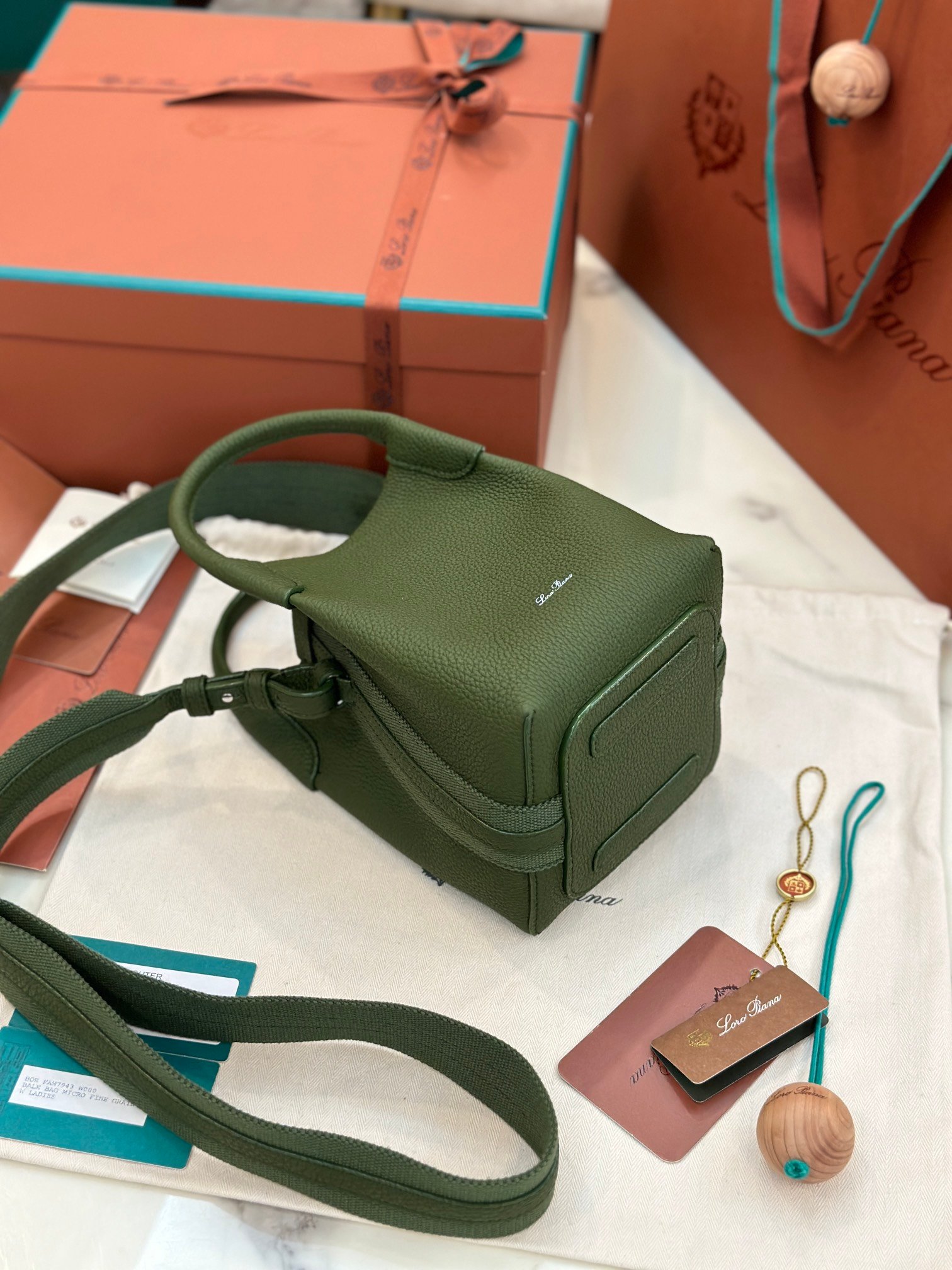 Loro Piana Bale Mini Bucket Bag Grained Calfskin Sophisticated Shoulder and Crossbody Handbag Craftsmanship and Versatile Luxury Loro Piana Bale Mini Bucket Bag Grained Calfskin Sophisticated Shoulder and Crossbody Handbag Craftsmanship and Versatile Luxury