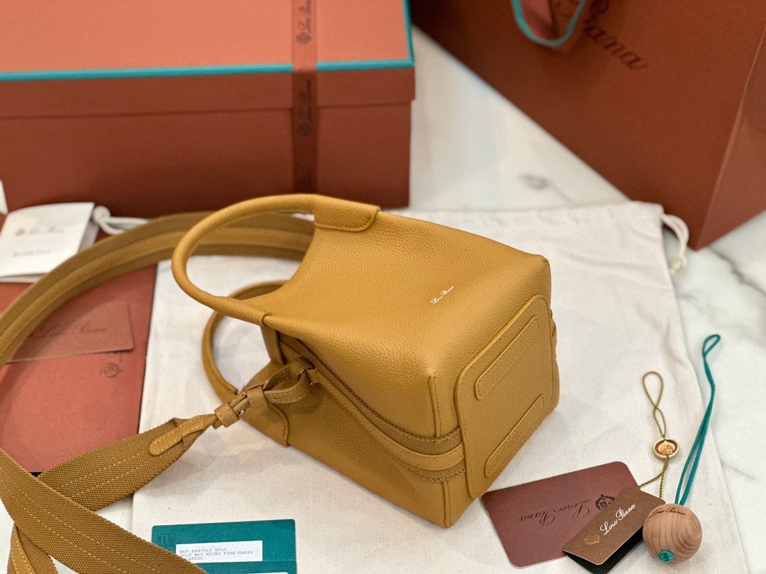 Loro Piana Bale Mini Bucket Bag Grained Calfskin Sophisticated Shoulder and Crossbody Handbag Craftsmanship and Versatile Luxury Loro Piana Bale Mini Bucket Bag Grained Calfskin Sophisticated Shoulder and Crossbody Handbag Craftsmanship and Versatile Luxury