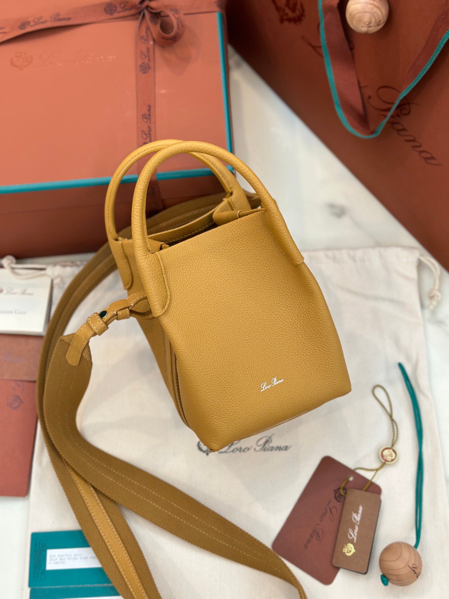 Loro Piana Bale Mini Bucket Bag Grained Calfskin Sophisticated Shoulder and Crossbody Handbag Craftsmanship and Versatile Luxury Loro Piana Bale Mini Bucket Bag Grained Calfskin Sophisticated Shoulder and Crossbody Handbag Craftsmanship and Versatile Luxury