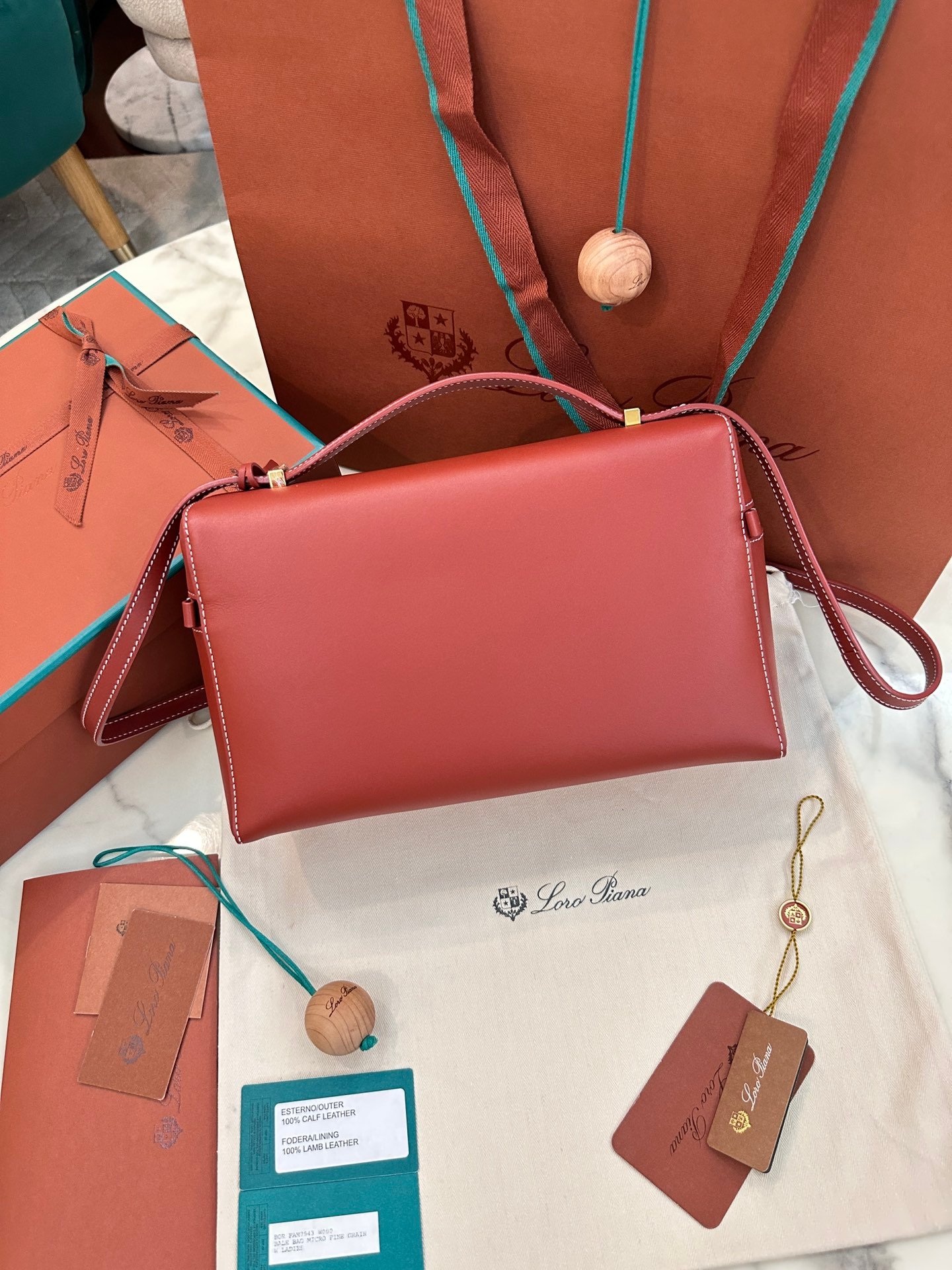 Loro Piana L27 Extra Bag 27 Minimalist Quiet Luxury Leather Tote Bag Structured Calfskin Crossbody Bag with Signature Padlock Loro Piana L27 Extra Bag 27 Minimalist Quiet Luxury Leather Tote Bag Structured Calfskin Crossbody Bag with Signature Padlock