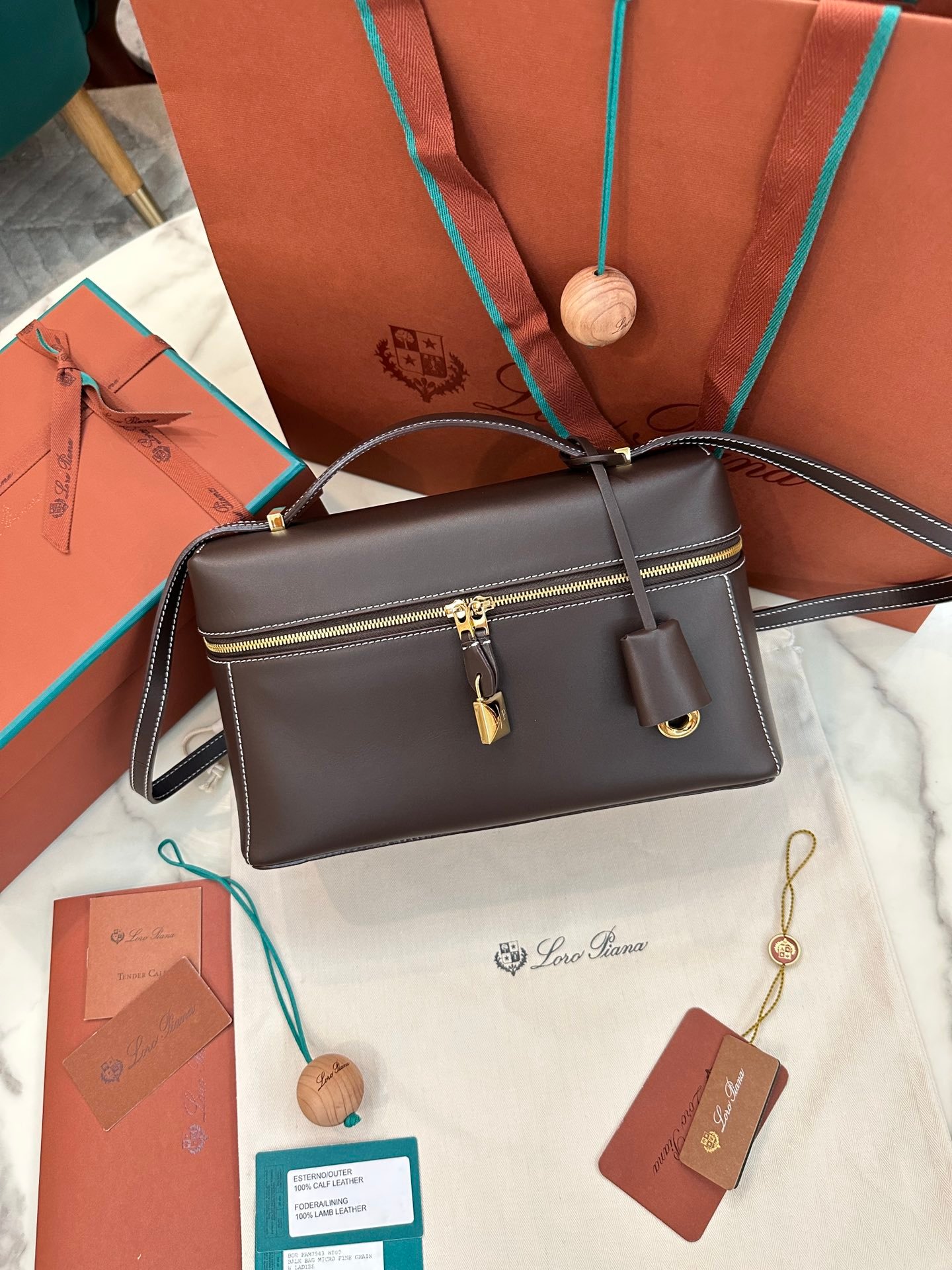 Loro Piana L27 Extra Bag 27 Minimalist Quiet Luxury Leather Tote Bag Structured Calfskin Crossbody Bag with Signature Padlock Loro Piana L27 Extra Bag 27 Minimalist Quiet Luxury Leather Tote Bag Structured Calfskin Crossbody Bag with Signature Padlock