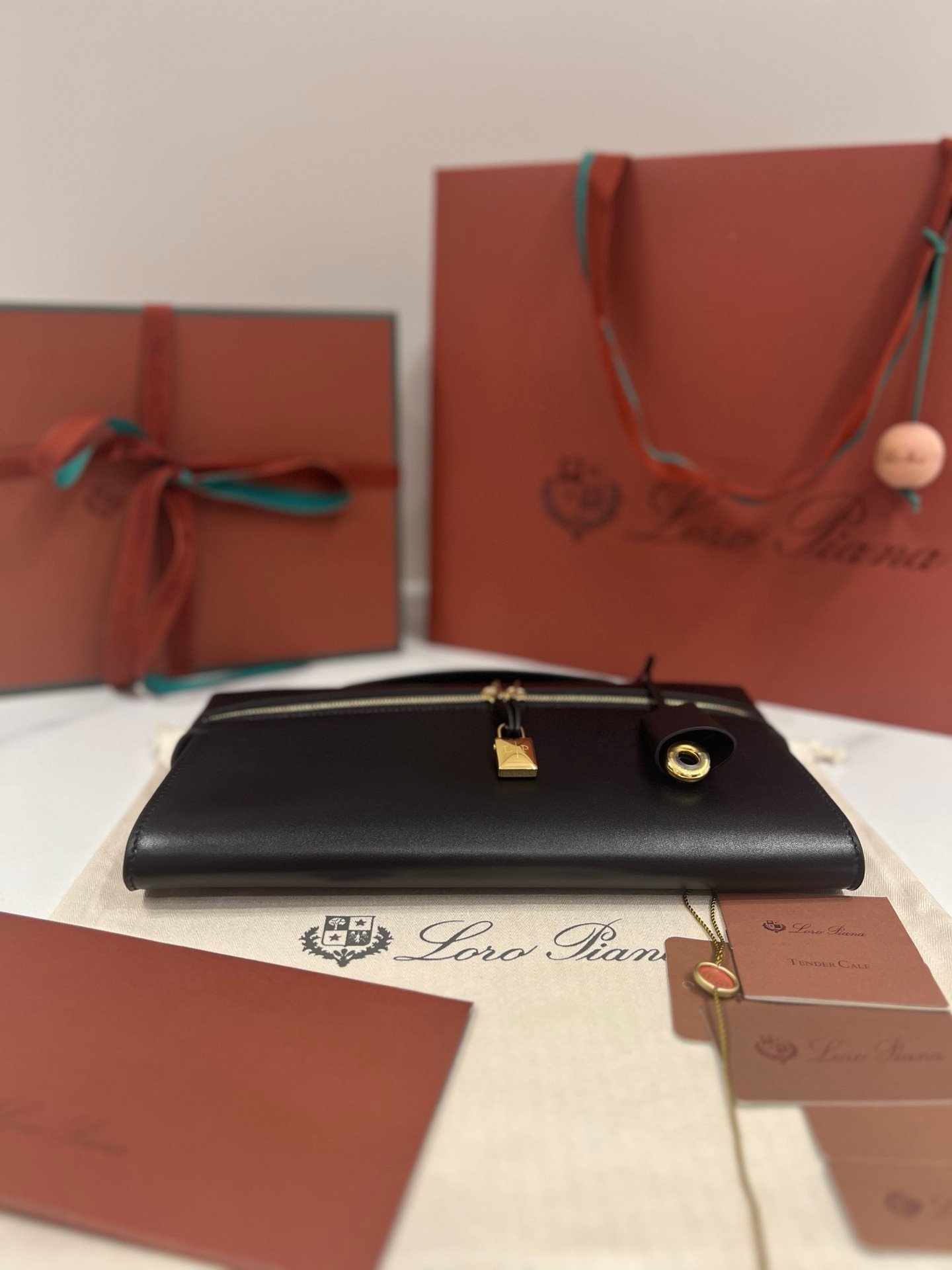 Loro Piana Extra L29 Clutch Bag 29cm Saddle Leather Elegant Handmade Designer Leather Handheld Purse with Signature Gold Padlock