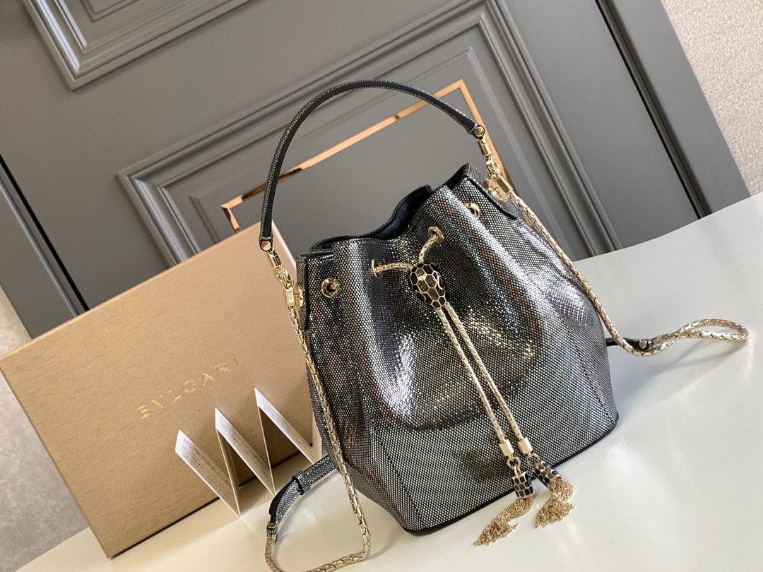 BVLGARI Serpenti Forever Metallic Karung Leather Bucket Bag 16cm Exotic Drawstring Crossbody and Top Handle Handbag with Signature Snakehead Closure BVLGARI Serpenti Forever Metallic Karung Leather Bucket Bag 16cm Exotic Drawstring Crossbody and Top Handle Handbag with Signature Snakehead Closure