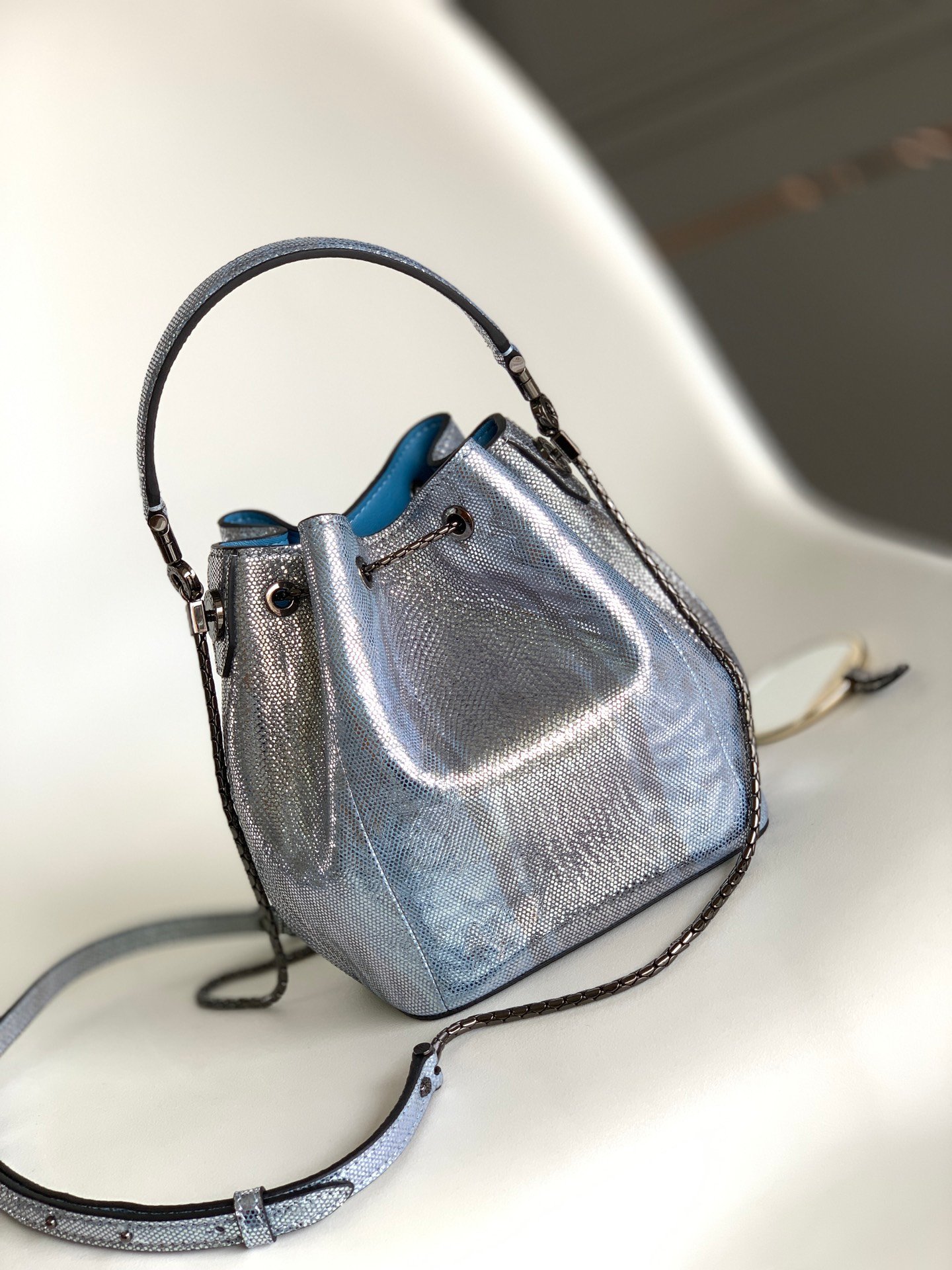 BVLGARI Serpenti Forever Metallic Karung Leather Bucket Bag 16cm Exotic Drawstring Crossbody and Top Handle Handbag with Signature Snakehead Closure BVLGARI Serpenti Forever Metallic Karung Leather Bucket Bag 16cm Exotic Drawstring Crossbody and Top Handle Handbag with Signature Snakehead Closure