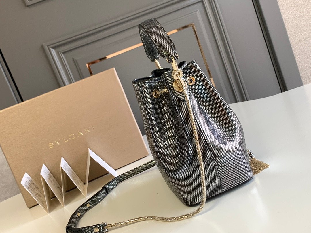 BVLGARI Serpenti Forever Metallic Karung Leather Bucket Bag 16cm Exotic Drawstring Crossbody and Top Handle Handbag with Signature Snakehead Closure BVLGARI Serpenti Forever Metallic Karung Leather Bucket Bag 16cm Exotic Drawstring Crossbody and Top Handle Handbag with Signature Snakehead Closure