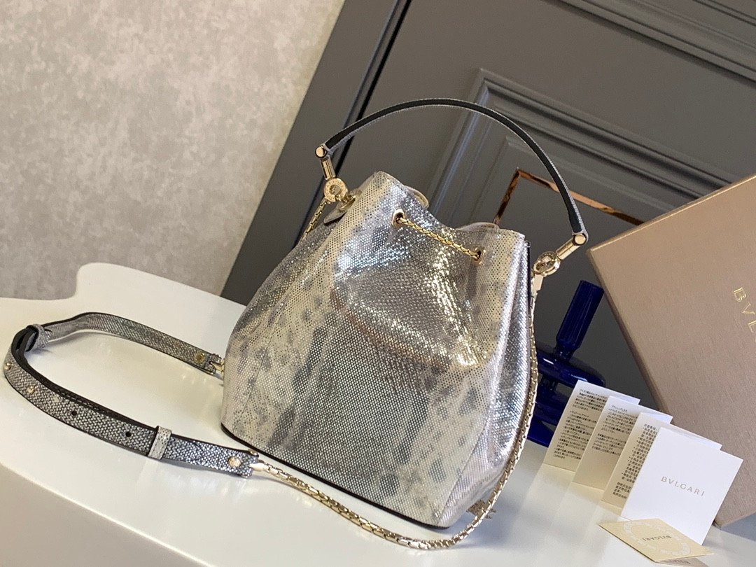 BVLGARI Serpenti Forever Metallic Karung Leather Bucket Bag 16cm Exotic Drawstring Crossbody and Top Handle Handbag with Signature Snakehead Closure BVLGARI Serpenti Forever Metallic Karung Leather Bucket Bag 16cm Exotic Drawstring Crossbody and Top Handle Handbag with Signature Snakehead Closure