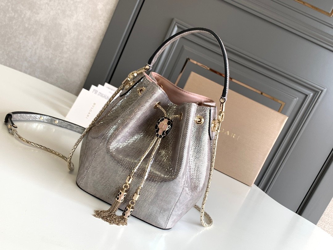 BVLGARI Serpenti Forever Metallic Karung Leather Bucket Bag 16cm Exotic Drawstring Crossbody and Top Handle Handbag with Signature Snakehead Closure BVLGARI Serpenti Forever Metallic Karung Leather Bucket Bag 16cm Exotic Drawstring Crossbody and Top Handle Handbag with Signature Snakehead Closure