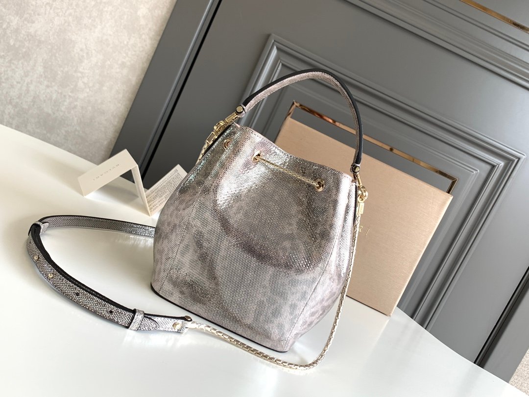 BVLGARI Serpenti Forever Metallic Karung Leather Bucket Bag 16cm Exotic Drawstring Crossbody and Top Handle Handbag with Signature Snakehead Closure BVLGARI Serpenti Forever Metallic Karung Leather Bucket Bag 16cm Exotic Drawstring Crossbody and Top Handle Handbag with Signature Snakehead Closure