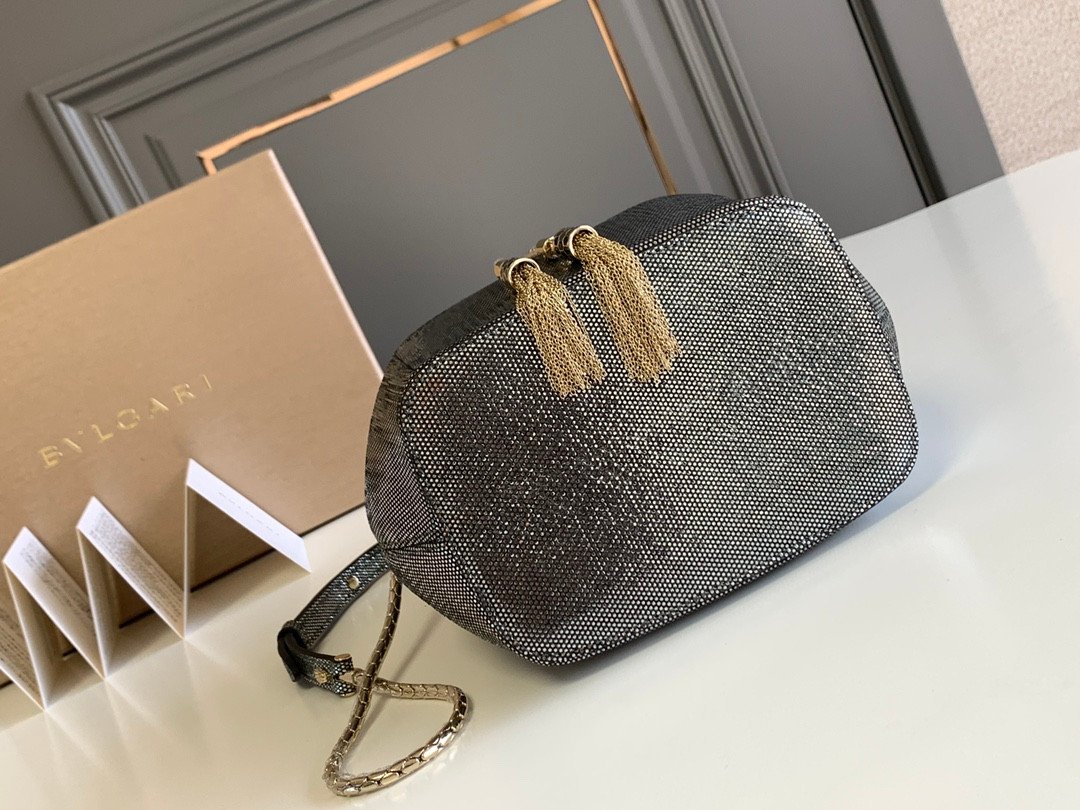 BVLGARI Serpenti Forever Metallic Karung Leather Bucket Bag 16cm Exotic Drawstring Crossbody and Top Handle Handbag with Signature Snakehead Closure BVLGARI Serpenti Forever Metallic Karung Leather Bucket Bag 16cm Exotic Drawstring Crossbody and Top Handle Handbag with Signature Snakehead Closure