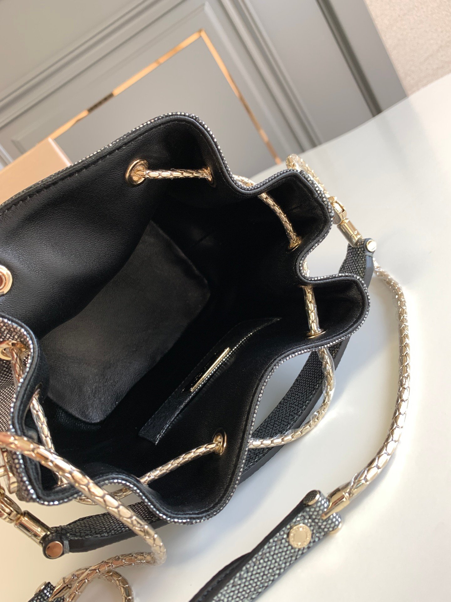 BVLGARI Serpenti Forever Metallic Karung Leather Bucket Bag 16cm Exotic Drawstring Crossbody and Top Handle Handbag with Signature Snakehead Closure BVLGARI Serpenti Forever Metallic Karung Leather Bucket Bag 16cm Exotic Drawstring Crossbody and Top Handle Handbag with Signature Snakehead Closure